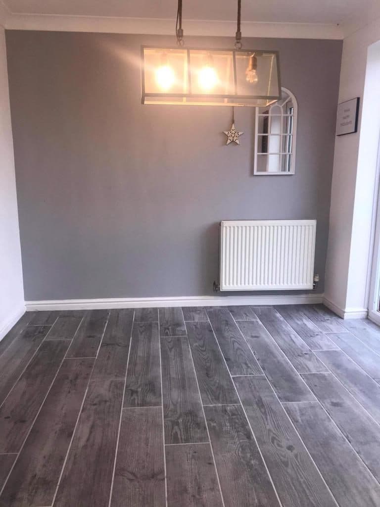 Renovated Room with Grey Wood Flooring